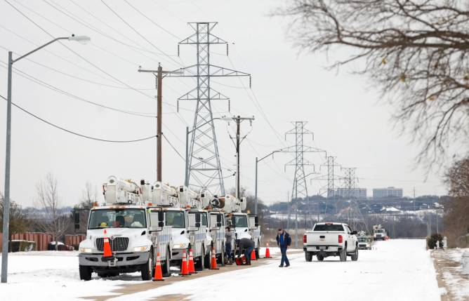 Pike Electric service trucks line up after a snow storm on February 16, 2021 in Fort Worth, Texas. 