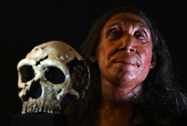 A picture shows the rebuilt skull and a physical reconstruction of the face and head, of a 75,000-year-old Neanderthal woman
