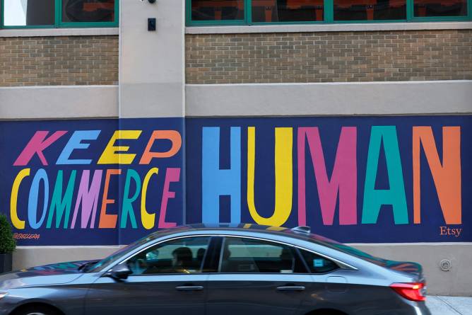 Mural that reads “keep commerce human” from Etsy campaign.