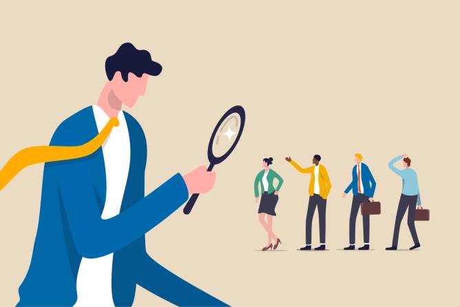 image of person looking at tiny people with magnifying glass