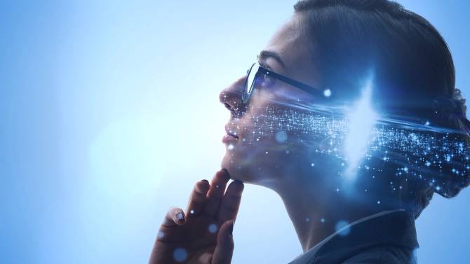 A person thinks while looking up. Digital dots suggest technological ideas in her head.