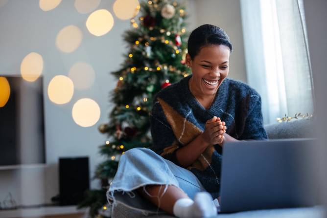 Woman holiday shopping on a computer