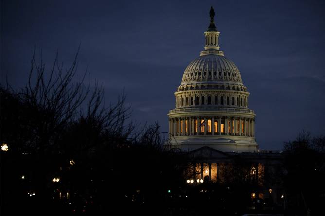 The united states capitol at night