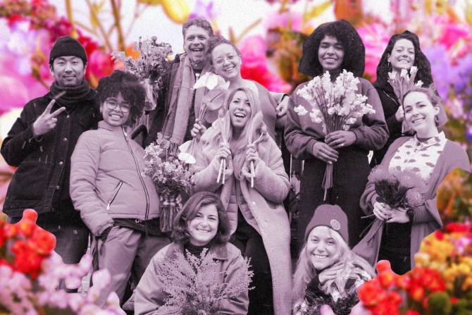 Employees of a flower shop with a designed background of colorful flowers.