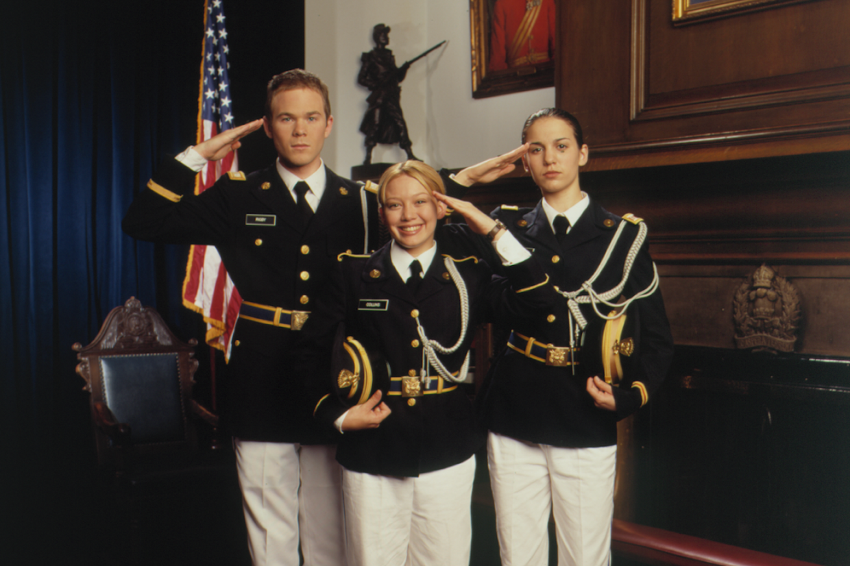 Kelly, Jennifery, and Brad in “Cadet Kelly” saluting in military uniforms.