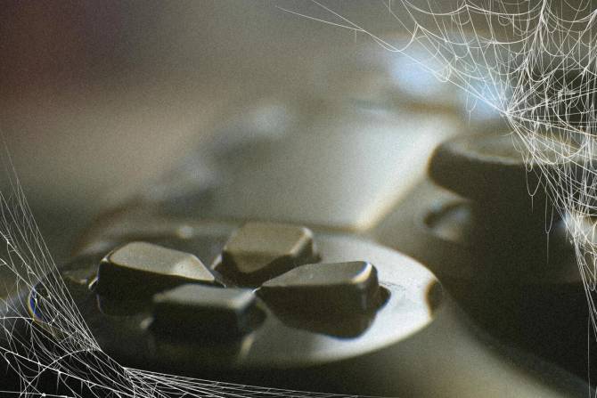 Gaming controller with cobwebs