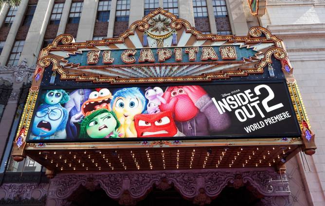 a movie theater marquee promoting the world premiere of 'Inside Out 2'