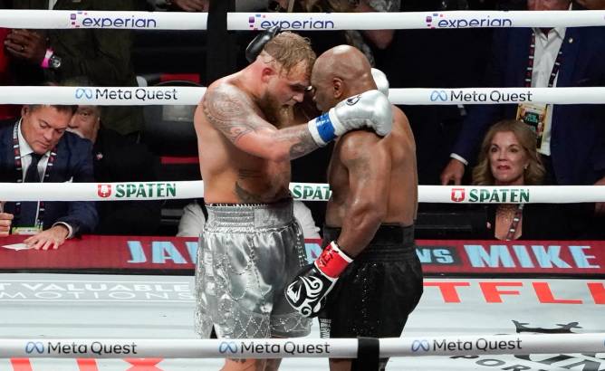 jake paul and mike tyson in the boxing ring