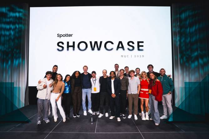 A group of YouTube creators poses on stage in front of a screen displaying the Spotter Showcase logo.