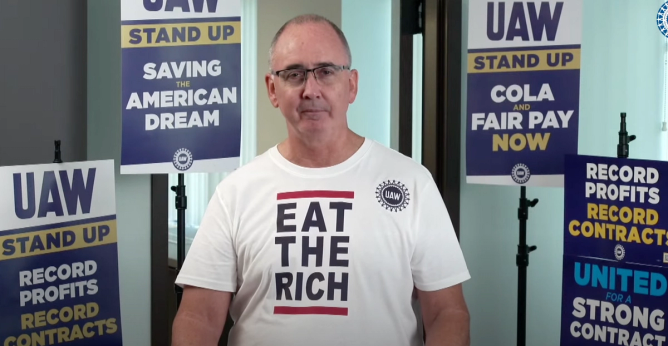 UAW President Shawn Fain in an Eat the Rich t-shirt