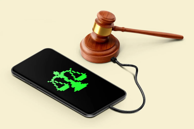 scales of justice in green pixels on a phone screen, plugged into a gavel