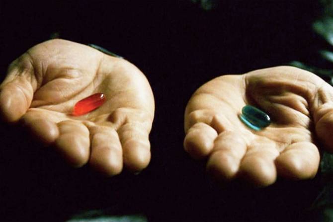 Two pills being handed out as seen in 'The Matrix'