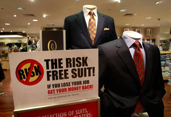 A suit with a sign saying the store gives refunds if you lose your job