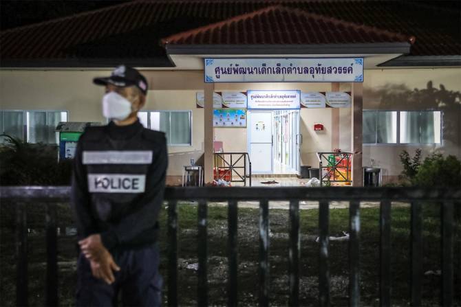 A police officer stands guard outside a child care center on October 06, 2022 in Thailand