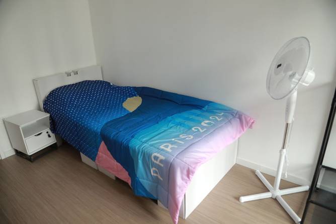 Olympics bedroom with a fan