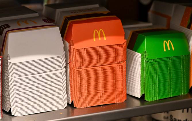 three stacks of empty mcdonald's sandwich boxes for food prep