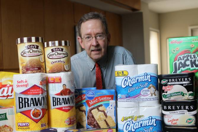 Consumer advocate Edgar Dworsky, posing here with some examples of shrinkflation he flagged, discovered Walgreens was incorrectly taxing cookies.. 