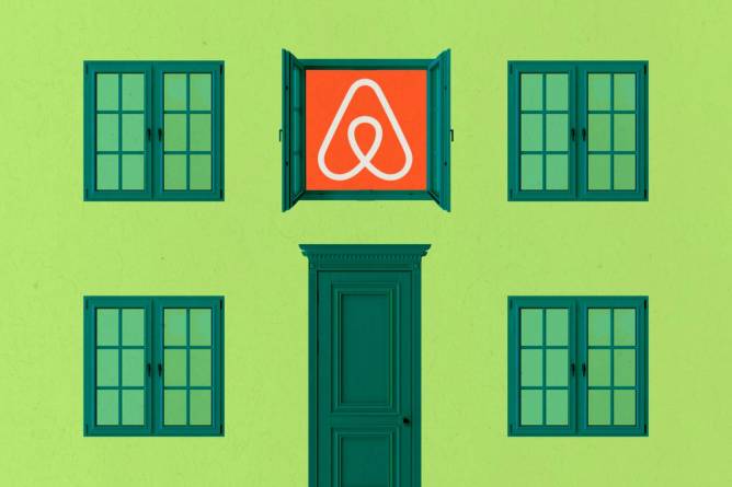 Apartment with closed windows and door, one window open with Airbnb logo.
