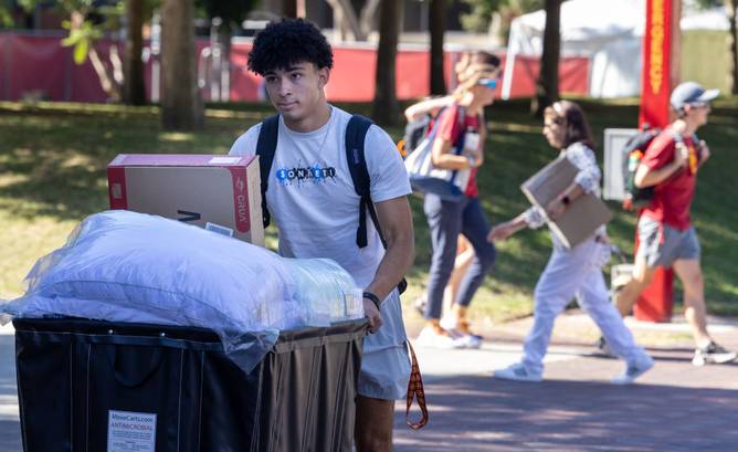 Students moving into a dorm