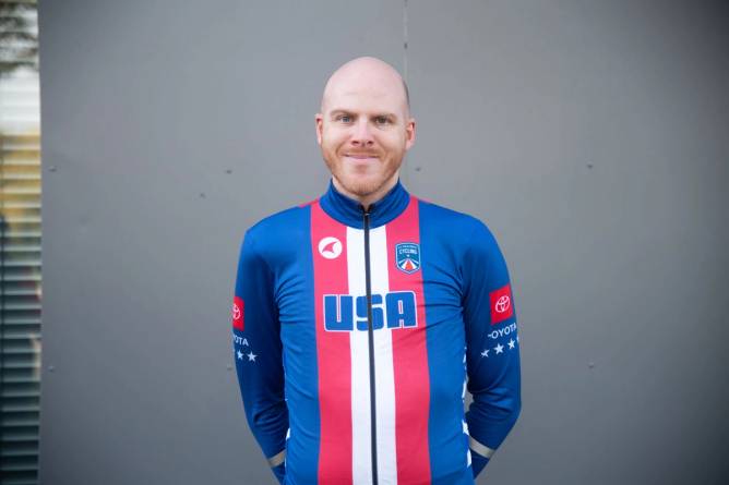 head shot of a thin white bald gentleman wearing a USA uniform and smiling