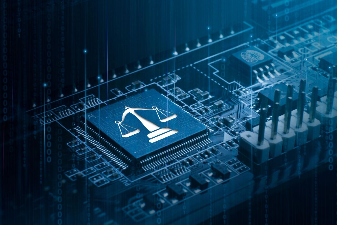 Scales of justice graphic on a microchip