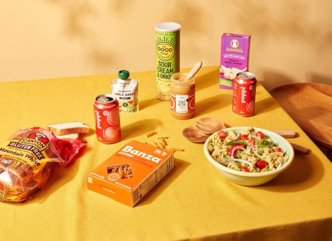 A variety of food items sold by Thrive Market arrayed on a table. 