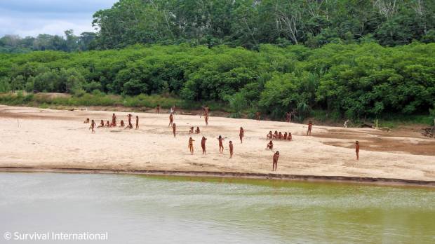 Members of a remote Amazon tribe on a beach