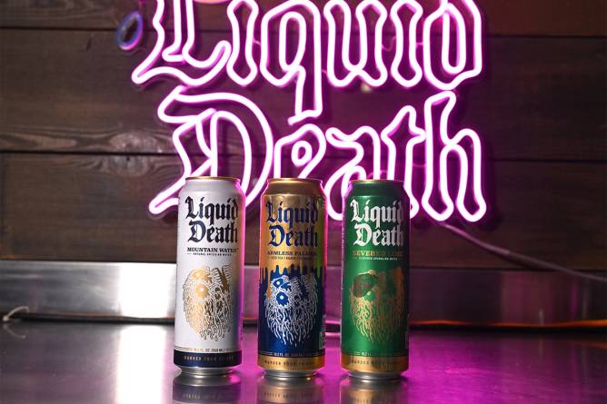 Three Liquid Death cans