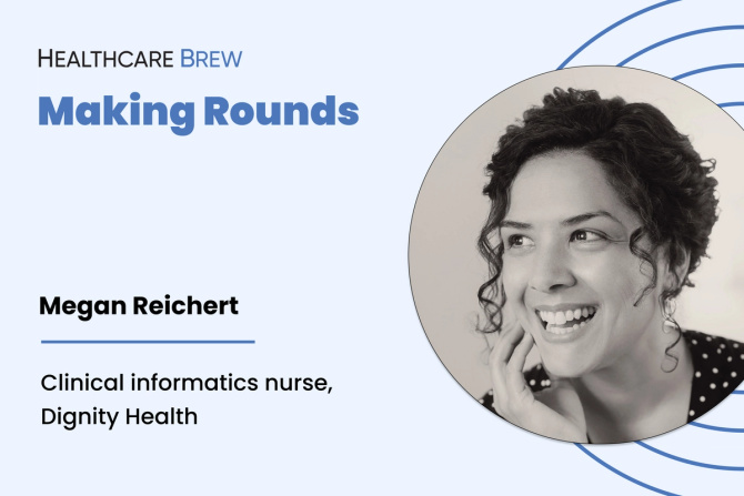 A woman looks to the left and smiles.