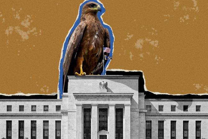 A hawk standing on top of the Federal Reserve building 