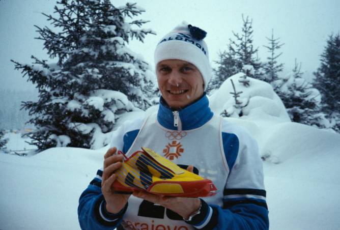 Skier holding Salomon boot in the snow
