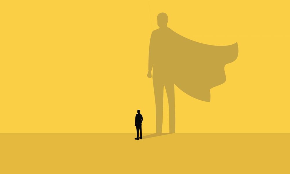 image of shadow that looks like a hero behind a silhouette of a person