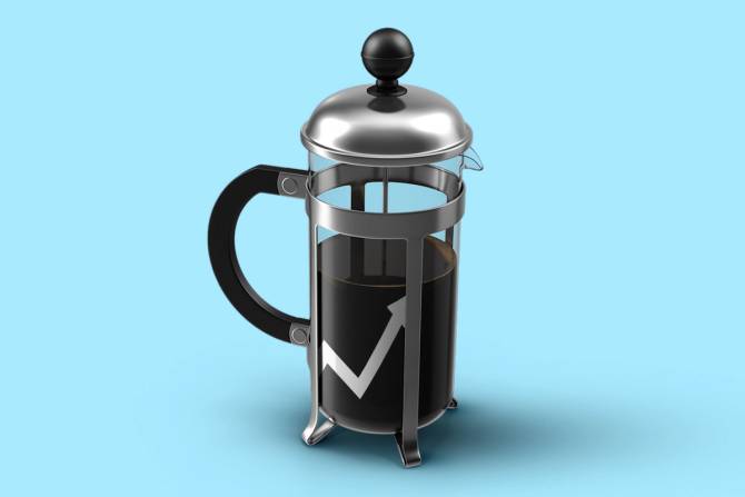 An image of a french press for making coffee in front of a blue background