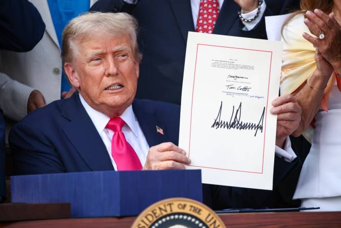 President Trump signs his sweeping tax-and-spending package