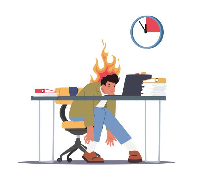 Man resting his head on his work desk, stressed and tired