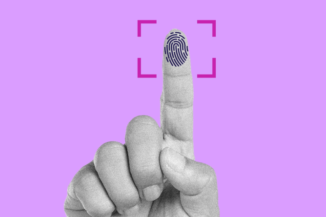 A hand holding an index finger up to a fingerprint scanner