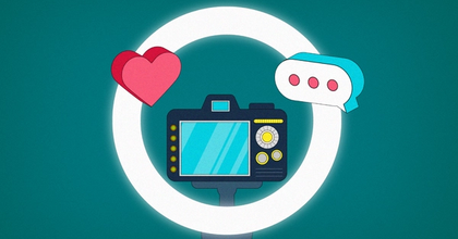 A heart and a text bubble on top of a ring light with a DXLR camera in the middle on a green background