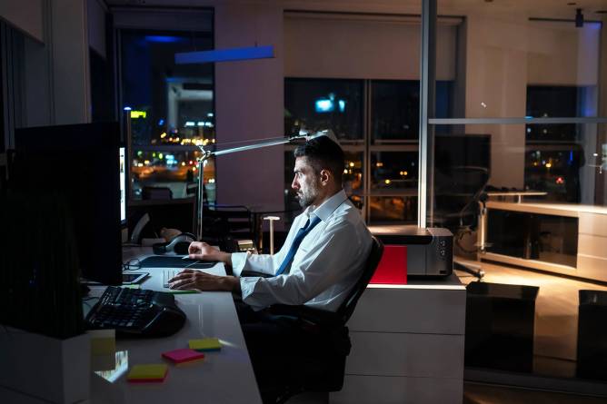 Man working late in office.