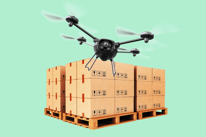 A drone flying over a pallet of boxes