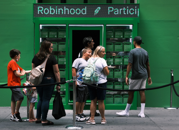 Youth outside a Robinhood-branded area.
