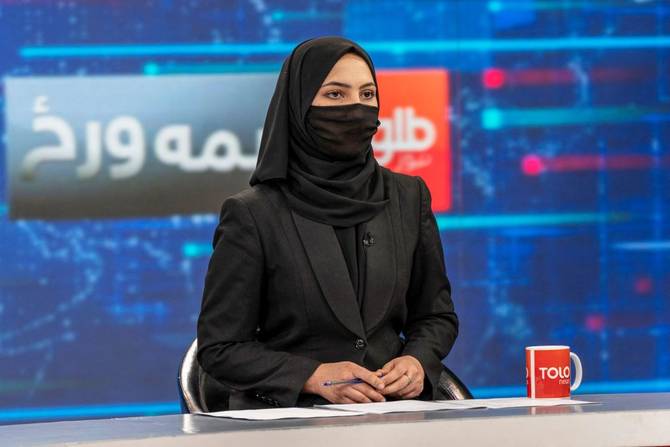 Sonia Niazi, covers her face in a live broadcast at Tolo TV station in Kabul 