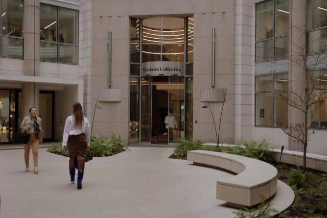 Vestaire Collective appears on a building in a still from the Netflix original series Emily in Paris 