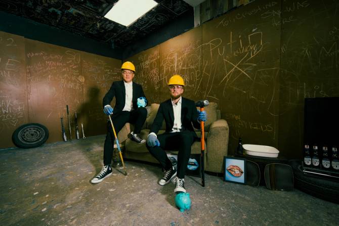 Paul and Woo in construction hats
