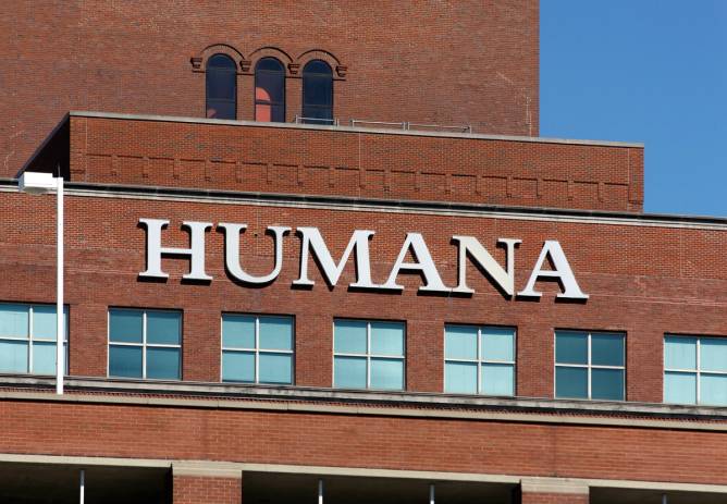 The exterior of a building with a sign for Humana