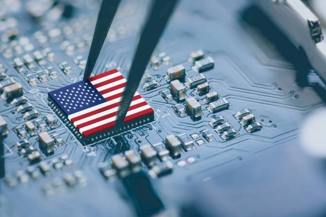 Microchip on a circuit with an American flag 