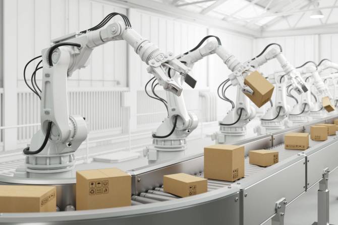 Robotic arms manage boxes on an assembly line.