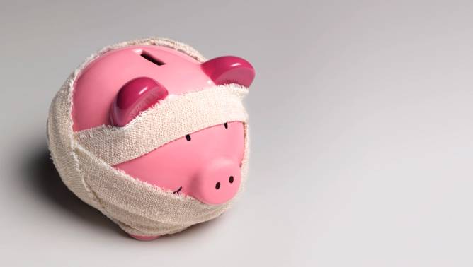 Piggy bank wrapped in bandages