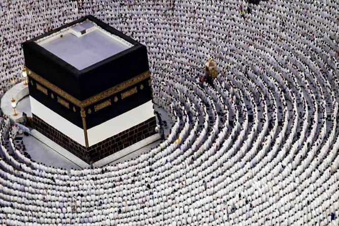 Muslim worshippers pray around the Kaaba, Islam's holiest shrine, at the Grand Mosque in Saudi Arabia's holy city of Mecca