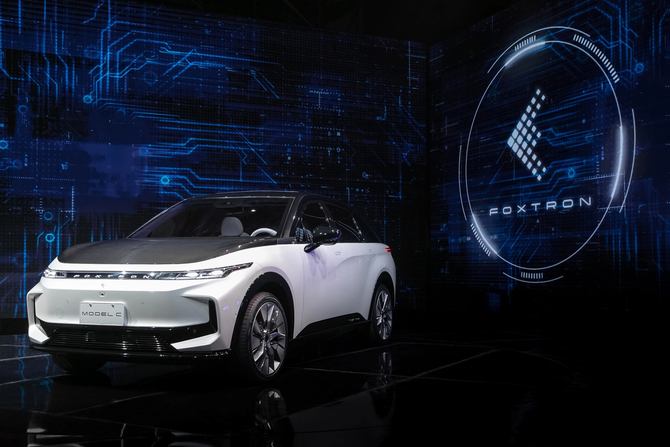 image of Foxconn's Model C crossover vehicle in white, against futuristic background