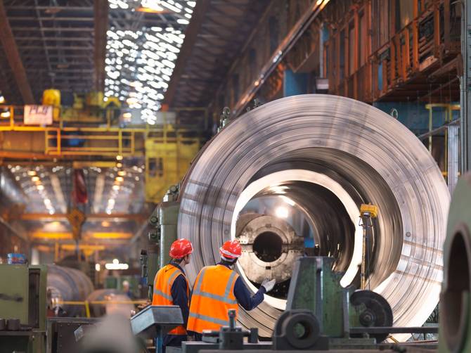 Image of steel workers inside of a plant